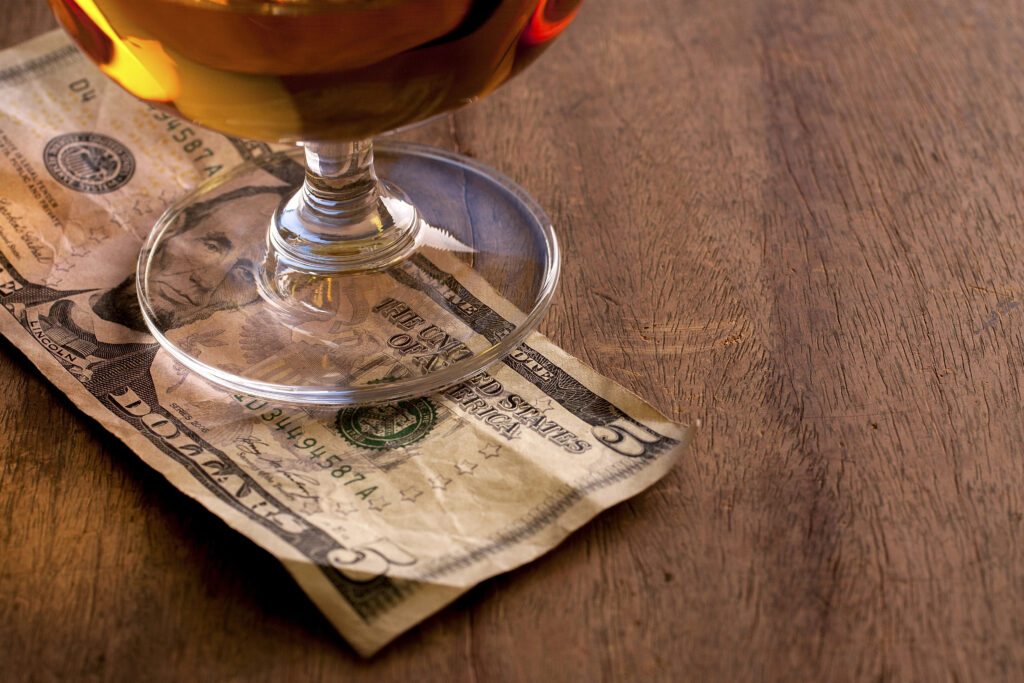 bill tip under a wine glass.