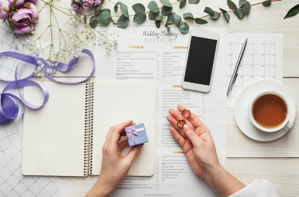 a detail wedding planning checklist on the top of the table.