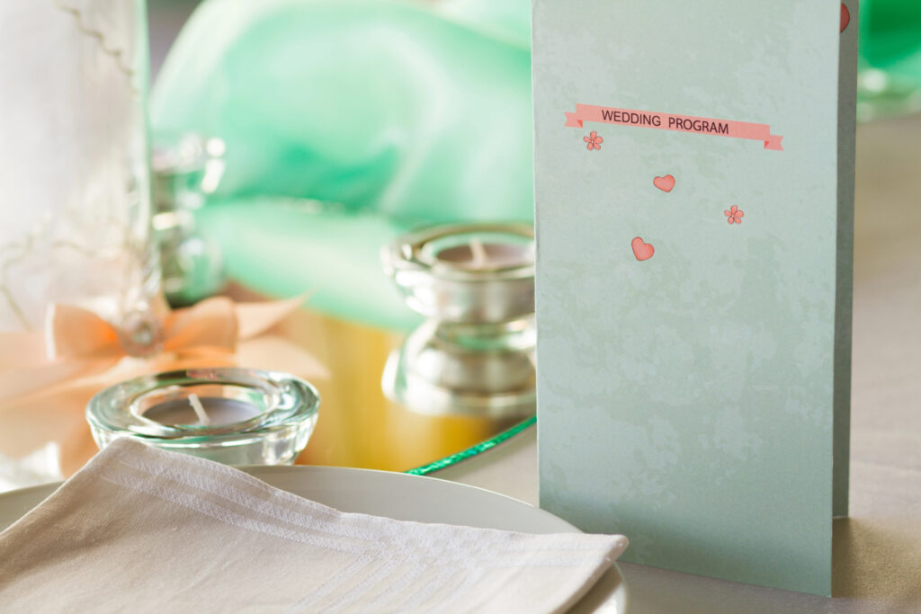 a wedding program on the top of a table.